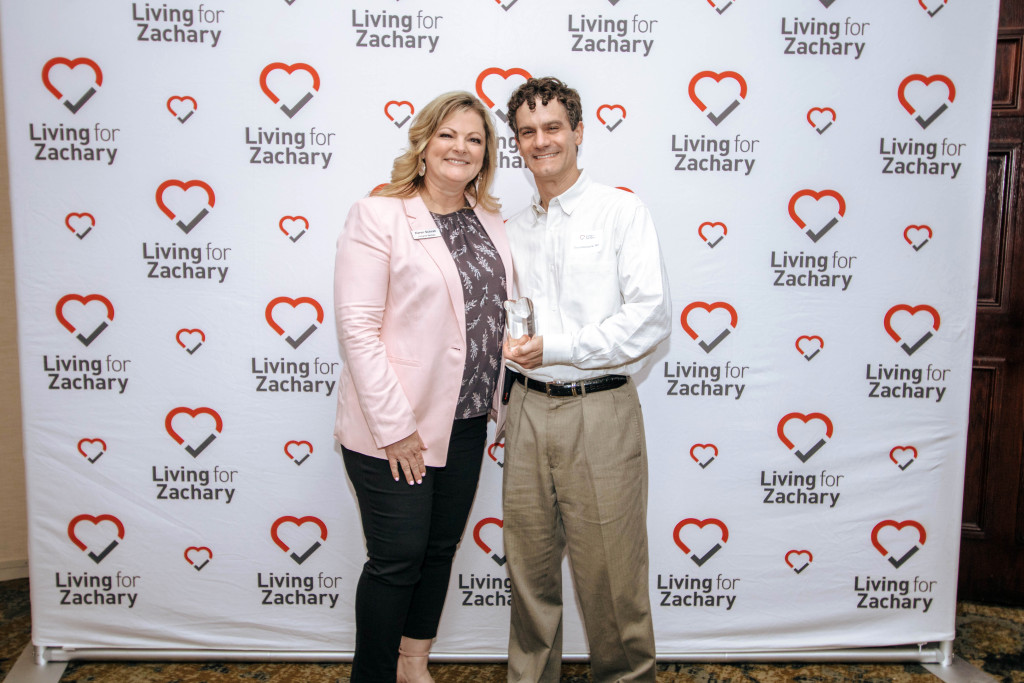 Living for Zachary Founder and President Karen Schrah with Volunteer of the Year David Rawitscher, MD